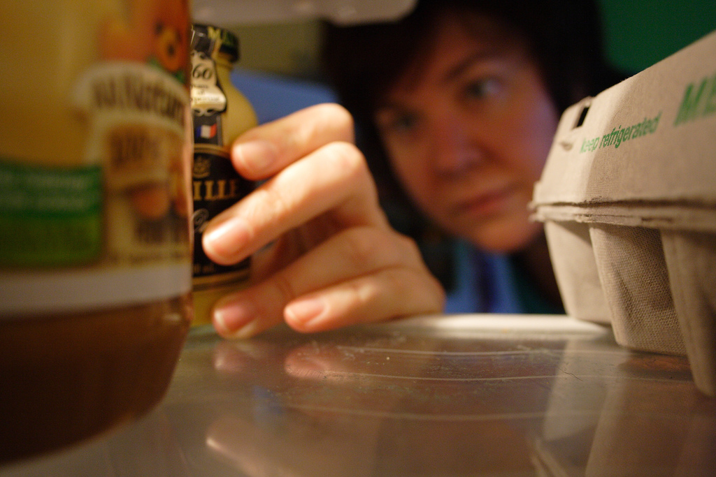 Woman looking into a fridge